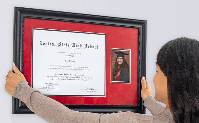 A woman hanging, a framed diploma on her wall
