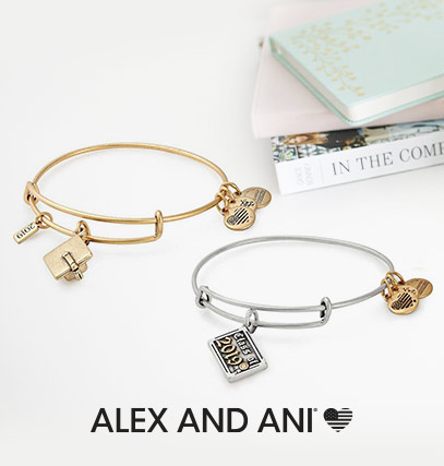 two alex and ani bracelets, next to a journal and text books