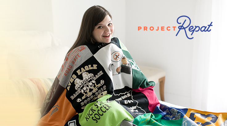  woman sitting on her bed with, a custom t-shirt quilt; made from her favorite tee shirts