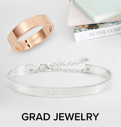 a graduation bracelet with, with graduation dte engraved; next to an engraved graduation ring 