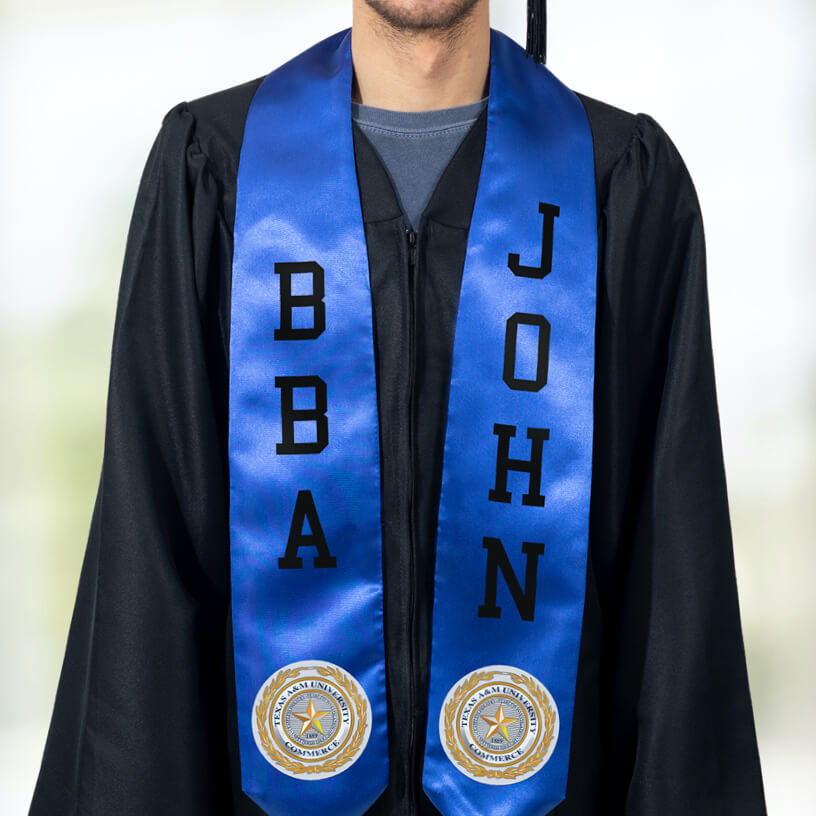 A graduate in a black graduation gown wearing a blue stole with FlexStyle® official college patches and text.