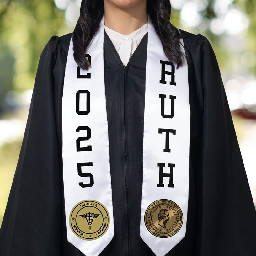 A graduate in a black graduation gown wearing a white stole with FlexStyle® official college patches and text.